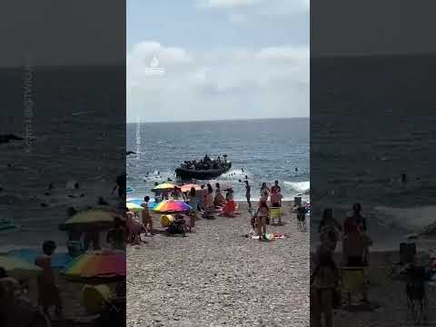 Dozens of migrants land on Spanish coast surprising beachgoers | AJ #shorts