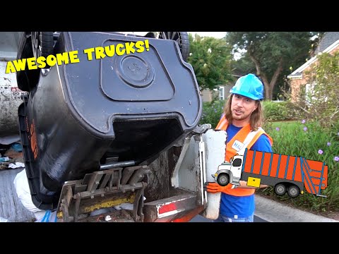 Worker in blue hard hat and orange vest near an overturned dumpster on a truck, with a cartoon truck graphic nearby and bold 'AWESOME TRUCKS!' text overlay.