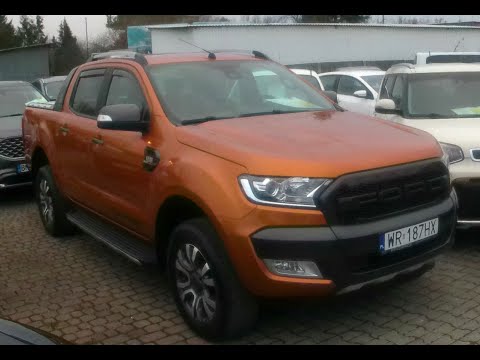 I'M LOOKING AT A FORD RANGER AT A DEALERSHIP. 4X4. HUGE PIECE OF MACHINE. PRICE. YEAR. CONDITION....