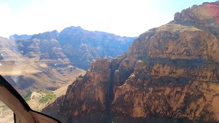 Grand Canyon helicopter skirts canyon walls on return to top from Colorado River