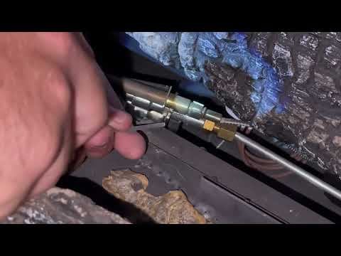 Cleaning the pilot on a ventless gas burners.