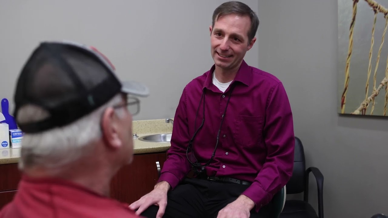 West Jordan dentist talking to a patient in the dental chair