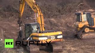 France: Diggers forge path to Calais refugee camp ahead of demolition