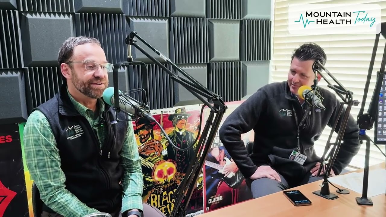 Dr. Brian Evans, Chief Medical Officer, and Dr. John Swanson, Medical Director of the Emergency Department, speaking into microphones in the Mountain Health Today podcast studio