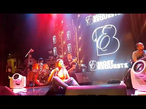 Morisette amon sing chandelier while sitting down.