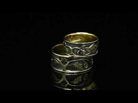 Alchemy of love — wedding ring made of yellow and white gold with a sapphire, covered with black rhodium