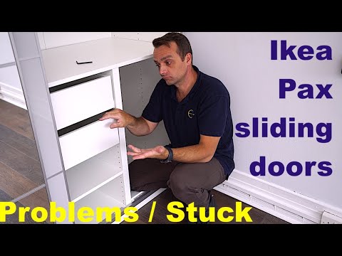 Part of a video titled Ikea pax wardrobe sliding door alignment - YouTube