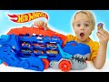 Chris plays with toy cars and saves Hot Wheels City