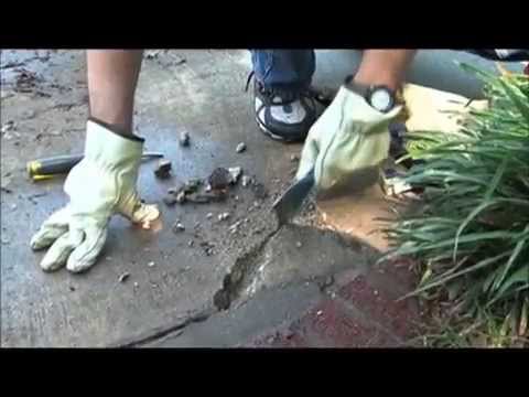 Part of a video titled Repairing Large Cracks In Cement With Fast Setting Cement Patcher