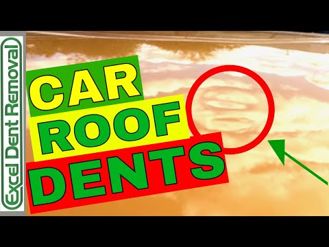Dents Removed From A Car Roof With Paintless Dent...
