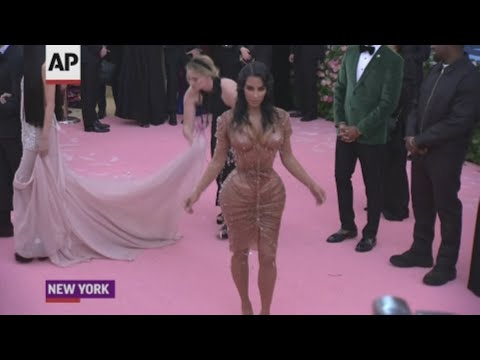 Kim Kardashian West and half-sisters Kylie and Kendall Jenner joined stars Emily Blunt, Salma Hayek and Gigi Hadid in embracing metallic and sequined looks at the Met Gala. (May 7)
