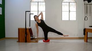 Variação do Kneeling Side Kicks na Cadeira com o Disco de EquilÃbrio