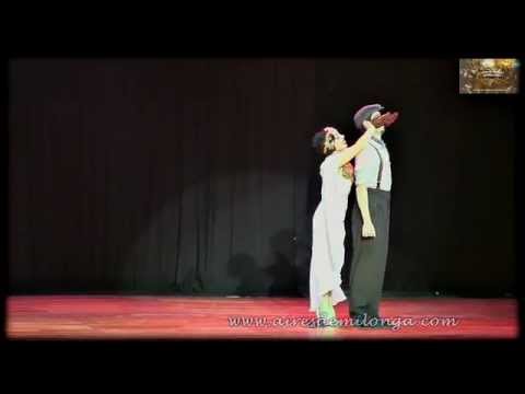 Giovanna Di Vincenzo  and  Sergio Martin Almiron  are  dancing  to  the  tango  "  A Evaristo Carriego  "  by  Forever Tango  in  2014