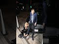 Larry King has his shoelaces tied for him by wife Shawn  ‍