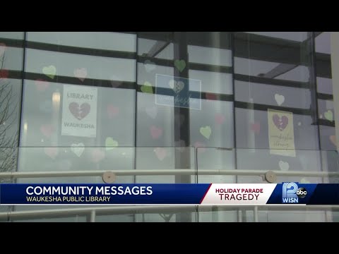 Paper heart display in library windows honors Waukesha parade victims