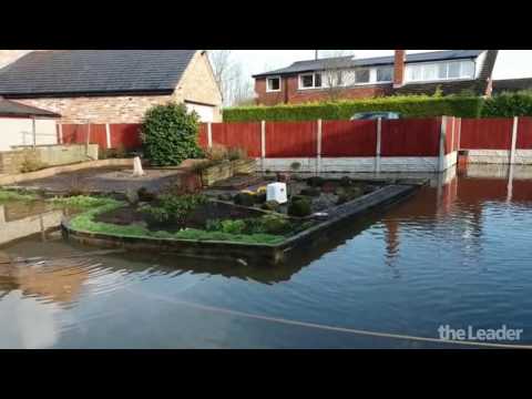 Flintshire 91-year-old woman battles flood water in her garden after Storm Doris