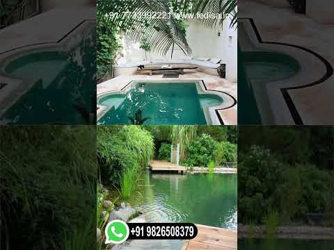 piscine-originale-forme-asymétrique-terrasse-pavés