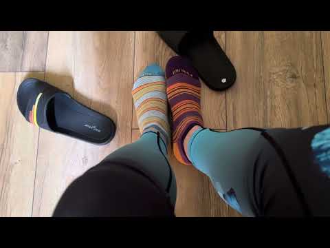Mismatched socks in leggings and slides