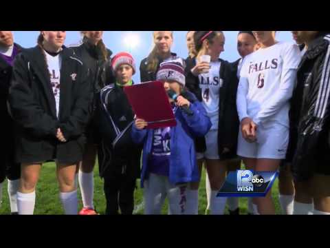 High school soccer team adopts girl, 9, with cystic fibrosis