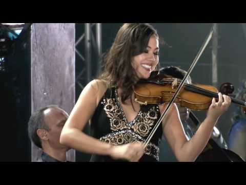 Mary Simpson performs with her joyful smile on Yanni's The Rain Must Fall