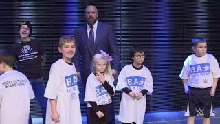 Triple H lets kids from Boys &amp; Girls Clubs of America charge the ring
