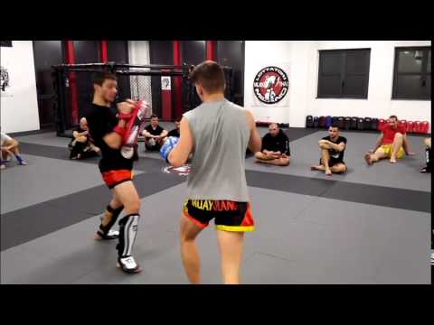 Coach Wolf holding pads for Mathias Gallo Cassarino