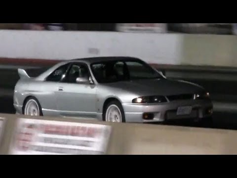 RHD Right Hand Drive Nissan Skyline drag race spinning hard at the track