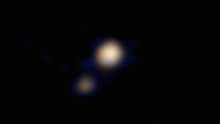 NASA probe sends back  first color image of Pluto