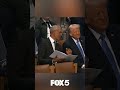 Donald Trump and Barack Obama share some laughs at Jimmy Carter's funeral