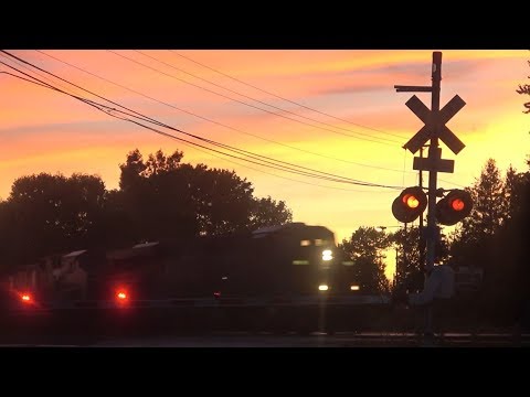 Two Trains Meet at Sunset + Freight Train Goes Under Signal Tower