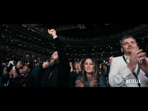Close-up trailer still of Michelle Obama greeting fans during the book tour