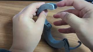 A shackle-like wrist band / toy prototype using a draw latch