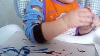 Tyler painting a picture