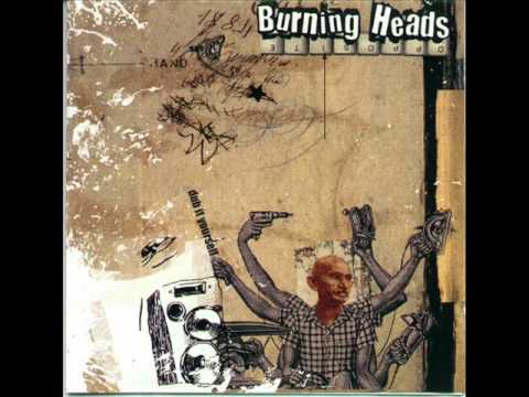 burning heads-police in helicopter-