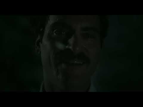 Trailer still of Theodore walking through warm-toned hallways, echoing the score’s intimate chamber textures