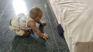 Insha watches cartoons while her mother works as a maid