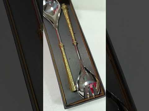 Stainless steel salad server with antique brass handles, no....