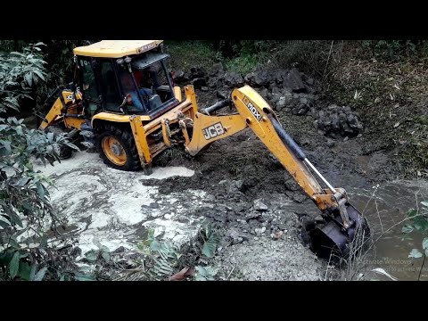 JCB Backhoe 3DX Breaking Concrete Wall In River (Bridge Foundation)
