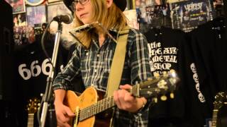 Sammy Brue sings the "Woody Guthrie Song" at the Heavy Metal Shop