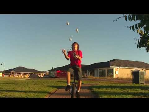 5 ball Juggling on Unicycle