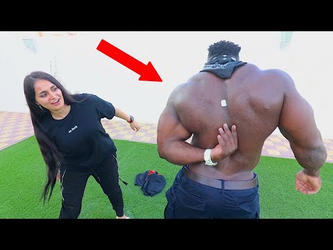 Bodybuilder Can't Reach Sticker on His Back !!!