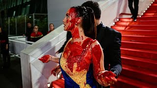 Watch: Woman clad in Ukrainian colours pours fake blood on herself at Cannes Film Festival