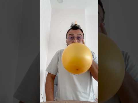 I pop the brown balloon with a needle