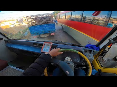 POV Bus Driving In City Narrow Road