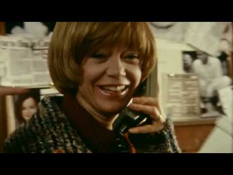 Trailer image: reel-to-reel and Super-8 camera on a table as a quiet piano line hangs in the air