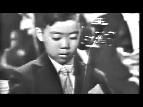 Leonard Bernstein presents 7-year-old Yo-Yo Ma's high-profile debut for President John F. Kennedy