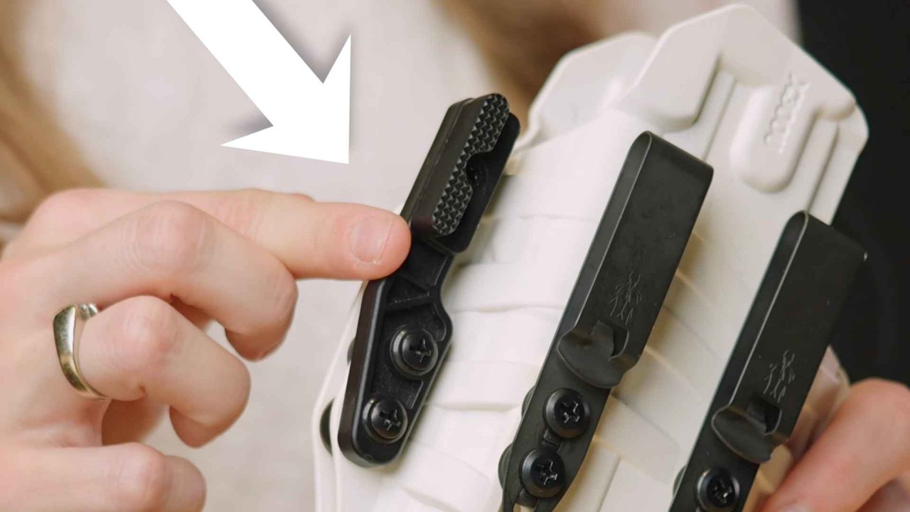 A holster wing helps rotate the gun towards...