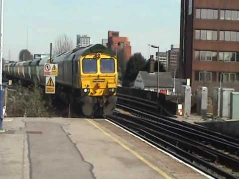 6O49 66624 with coal hoppers through Basingstoke 16/03/10