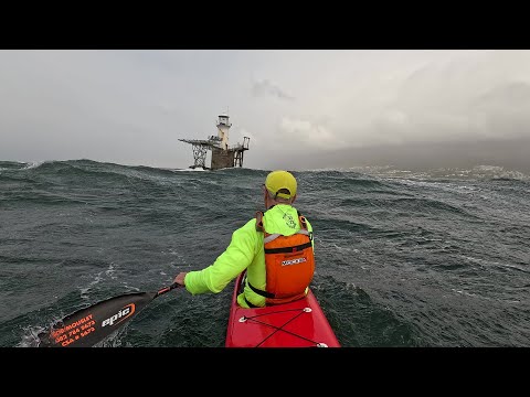 Spicy winter downwind paddling...  Buzzing the lighthouse on the Red Rocket