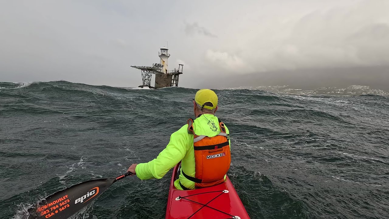 Spicy winter downwind paddling...  Buzzing the lighthouse on the Red Rocket